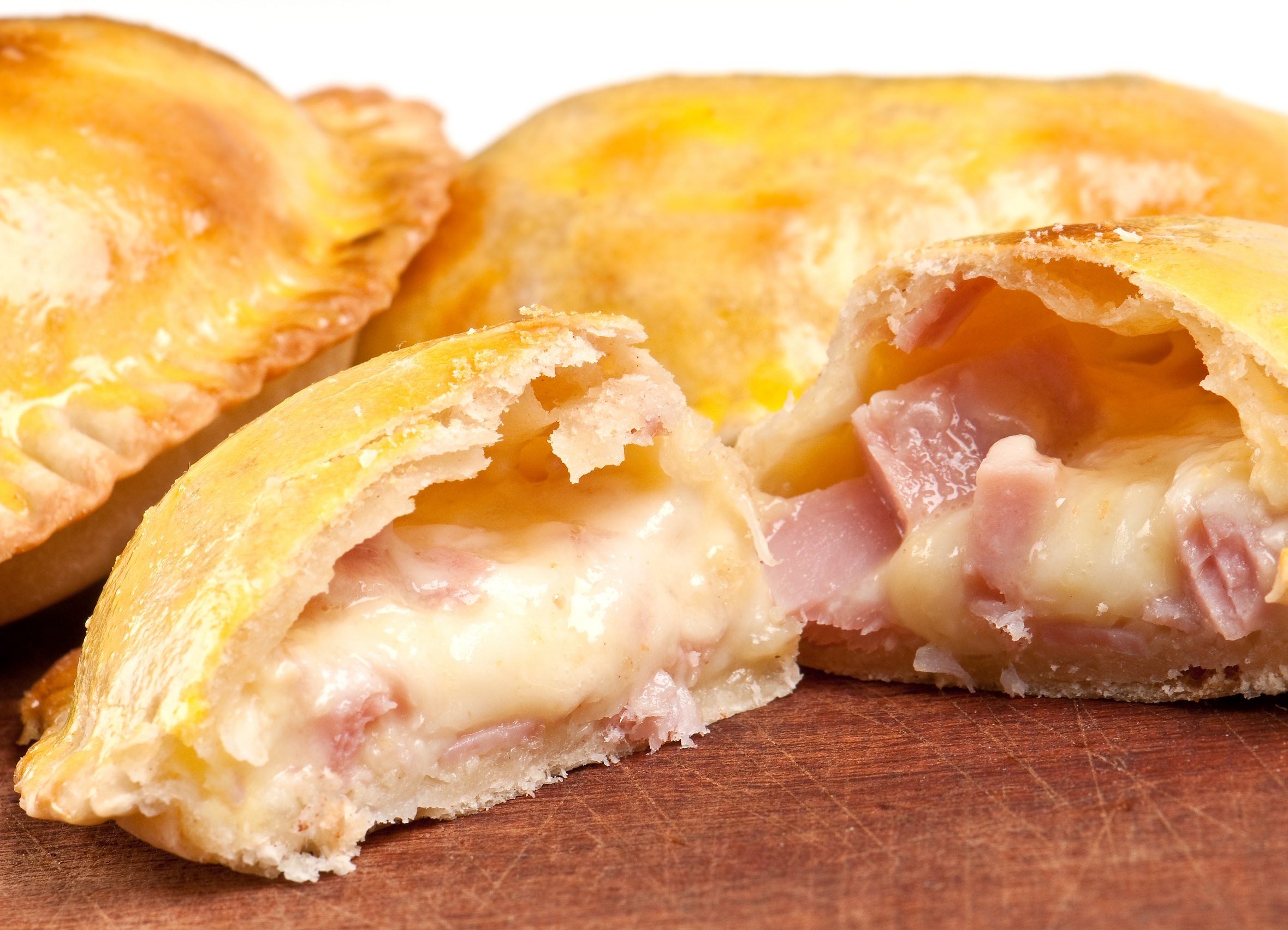 Empanada with ham and cheese available at Bienvenidos Latin Market in Ottawa. A classic empanada filled with savory ham and melted cheese.